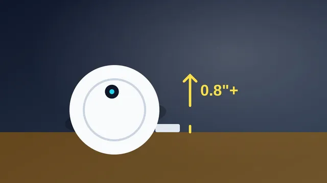 Illustration of a robot vacuum about to climb over a door threshold